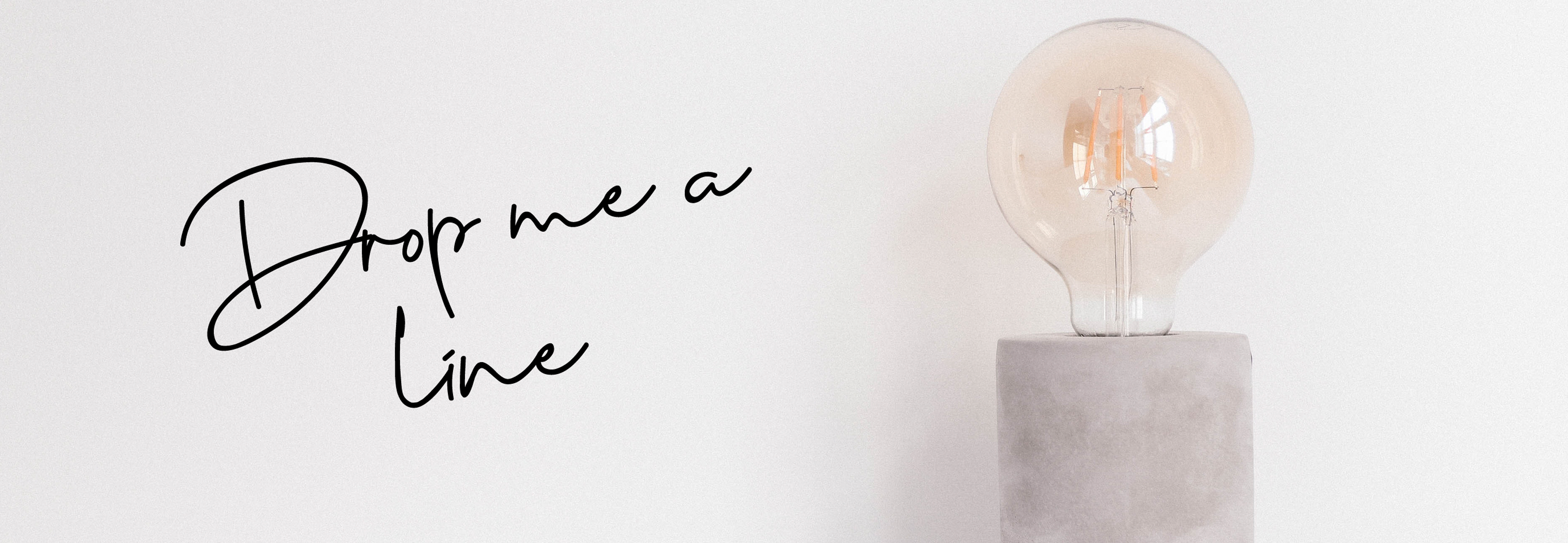 contact us to find out  more about working with a copywriter. Lightbulb on a white background.