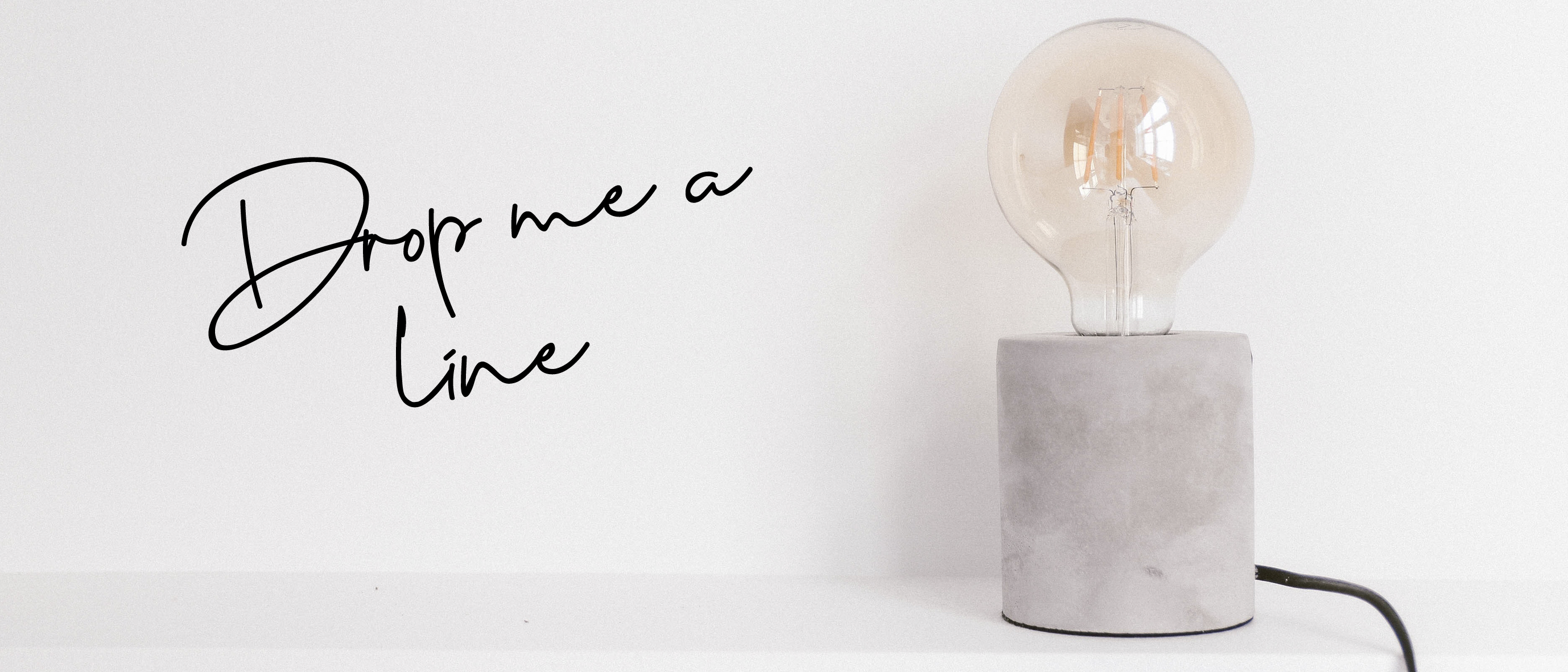 contact us to find out  more about working with a copywriter. Lightbulb on a white background.